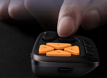 Close-up of CYKE Bluetooth remote control with silent function, featuring orange buttons, ideal for bluetooth remote control for content creation.