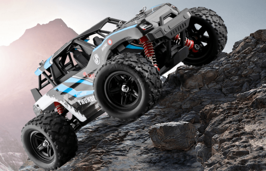 Large High-Speed Remote Control Off-Road Car climbing a rocky terrain, showcasing its powerful four-wheel drive capabilities.