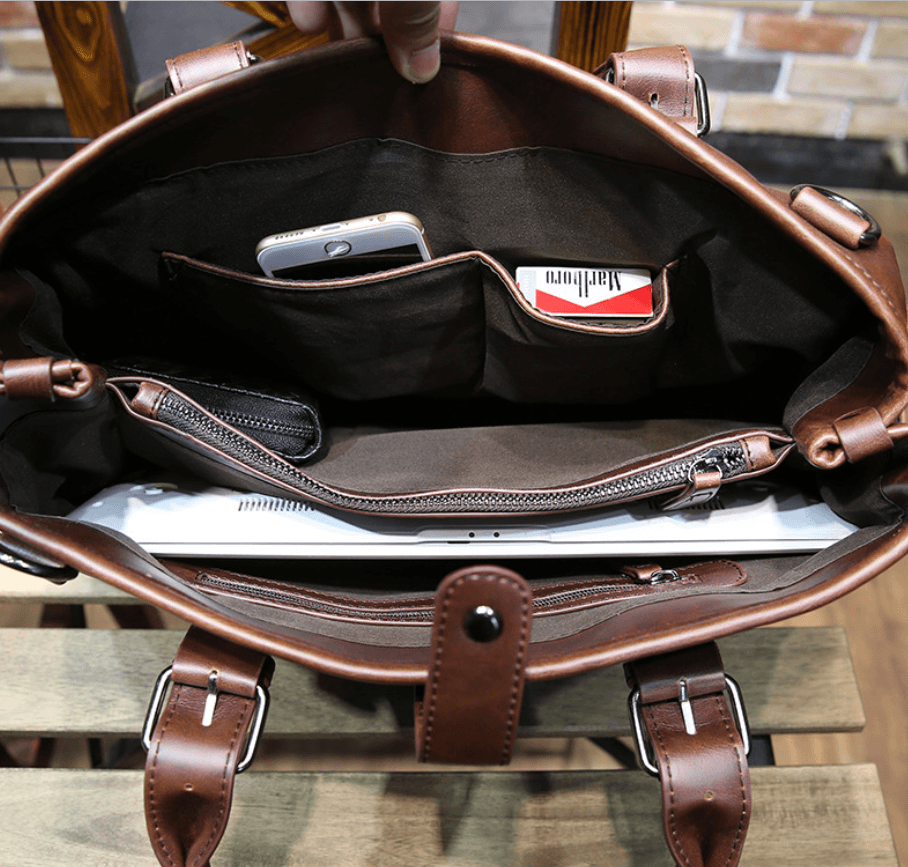 Interior view of a vintage men's crossbody bag showcasing compartments for organizing essentials.