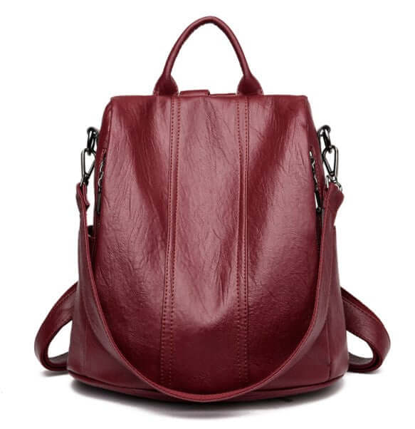 Anti-Theft Women's Backpack, Shoulder Bag in stylish red leather with dual carrying options.