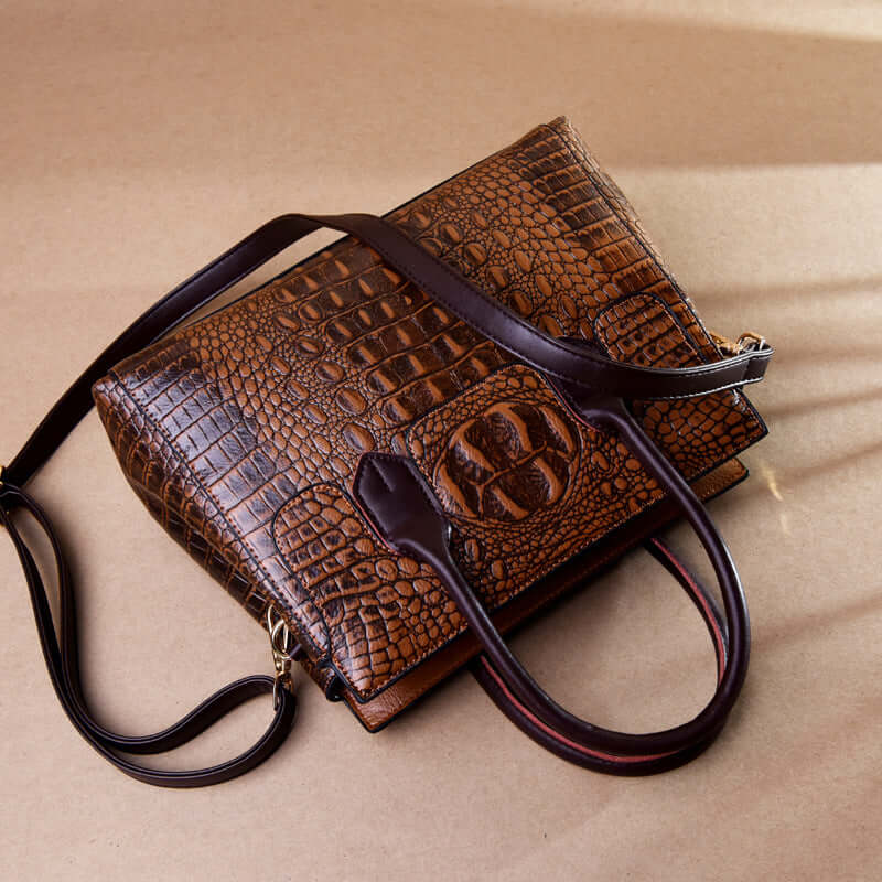 chic women's fashion tote bag in brown crocodile pattern with long shoulder strap and stylish design