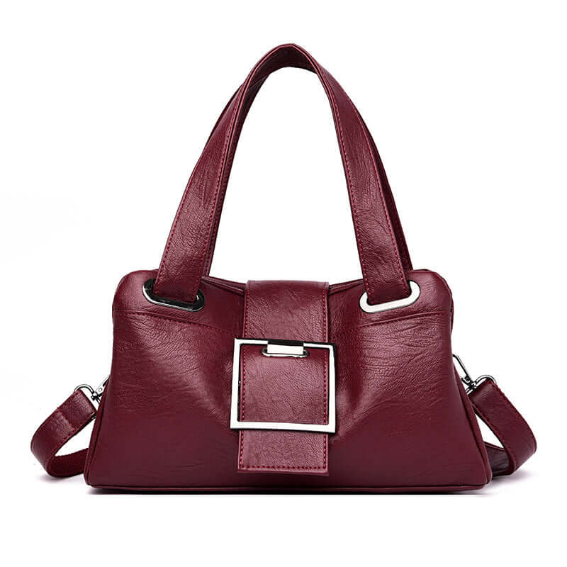 European American leather handbag in elegant burgundy color with stylish buckle detail and dual handles.