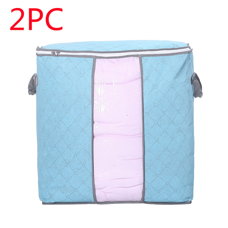 Quilt storage bag for moving in blue with pink lining, ideal for organized clothing storage.