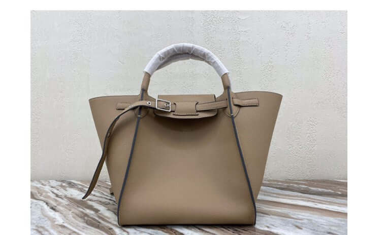 Chic crossbody shoulder bag in elegant beige with dual handles and sophisticated design.