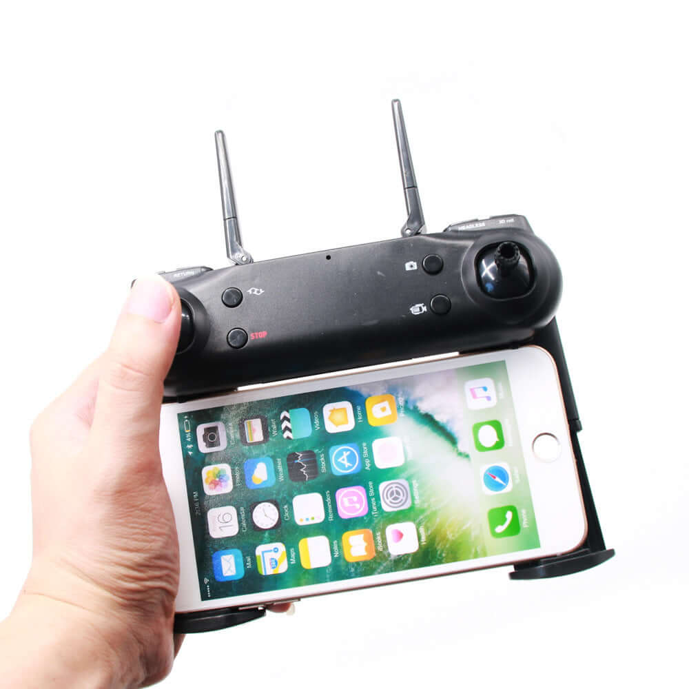 DM107S foldable drone with dual cameras remote controller displaying smartphone for aerial photography