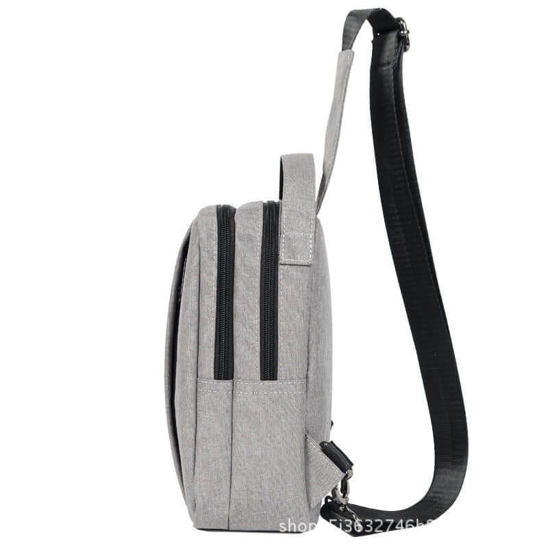 Chest Bag, Crossbody Bag, Shoulder Bag in gray canvas with zippers and adjustable strap.