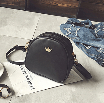 Chic crossbody shoulder bag in black PU leather with a crown logo, perfect for daily adventures.