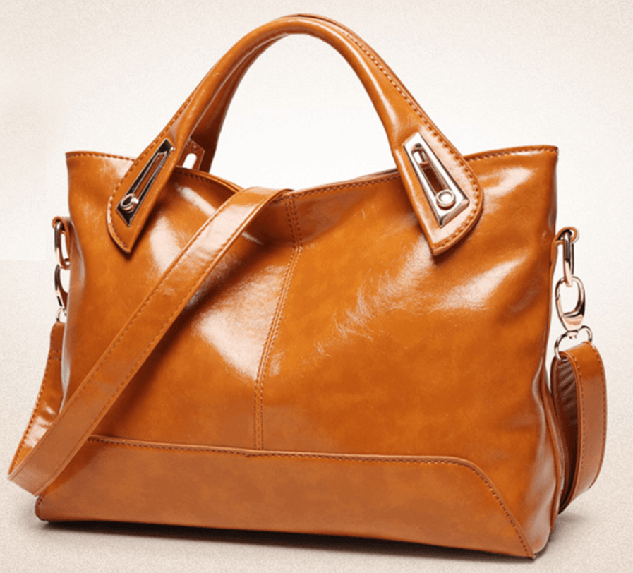 Stylish Crossbody Bag, Shoulder Bag, Tote Bag in brown leather with adjustable strap and sleek design.