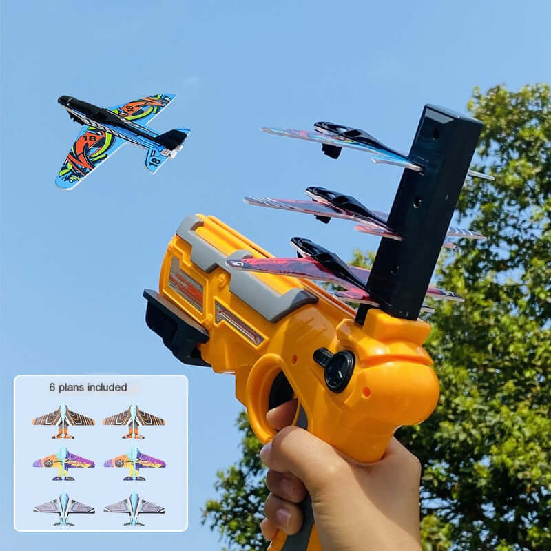 Children's Foam Plane Glider Outdoor Toy Launcher being launched from a toy gun, colorful planes flying against a sunny sky.