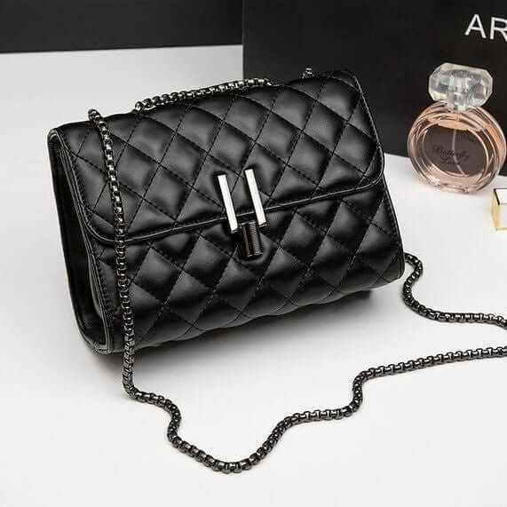 Trendy women's messenger handbag featuring a stylish quilted design with chain strap and elegant clasp detail.
