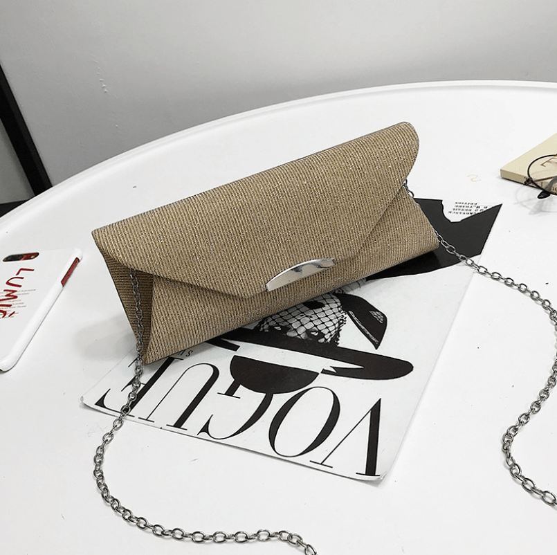 Evening clutch bag in a chic tan design with a chain strap, perfect for parties and special occasions.