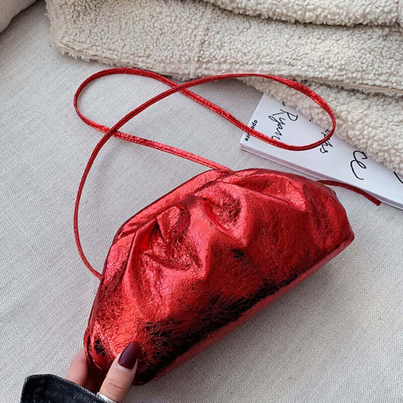 Fashion shoulder dumpling bag in shiny red, perfect for adding a trendy touch to any outfit.