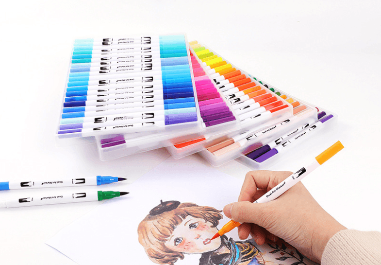 Person using Water-Based Color Markers and Drawing Pens to color an illustrated drawing with vibrant hues.