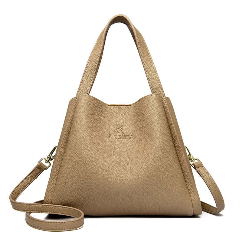 New women's crossbody tote bag in camel color, featuring stylish dual handles and adjustable shoulder strap.