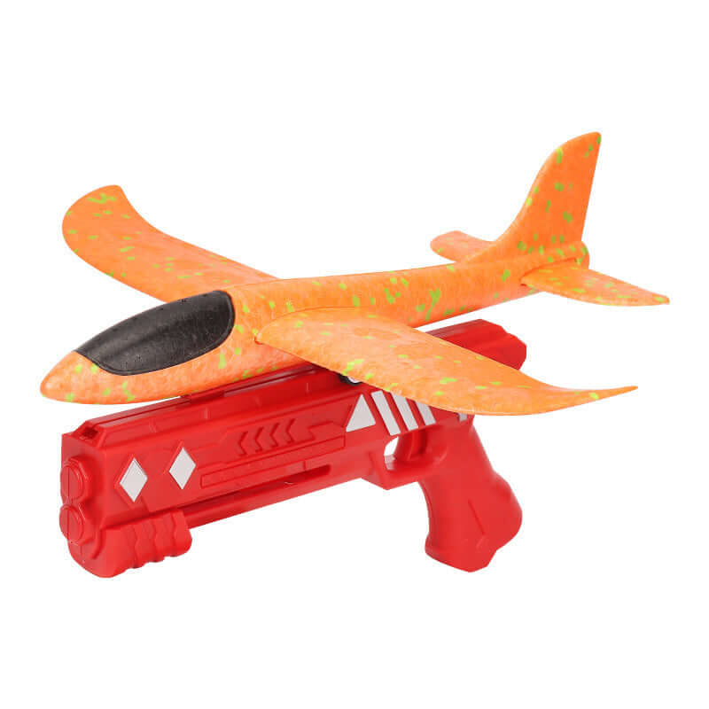 Light-up plane launcher toy for kids featuring a vibrant orange airplane on a red launch gun.