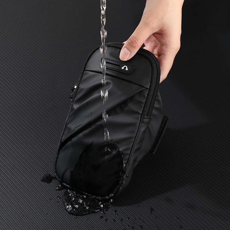 Adjustable Waterproof Arm Bag for Running and Cycling being tested with water to showcase its waterproof features.