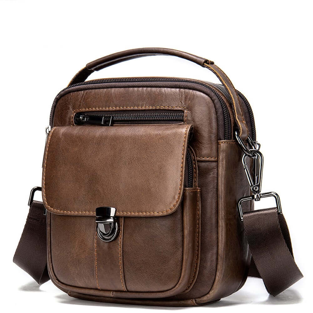 Chic crossbody shoulder bag in brown leather with a secure zipper and front pocket, perfect for stylish functionality.