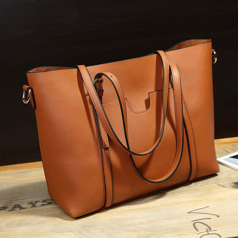 Stylish bucket shoulder bag in brown PU leather, perfect for modern elegance and everyday functionality.