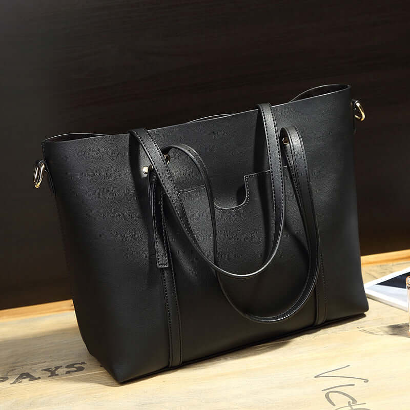 Shoulder Bag, Bucket Bag, Crossbody Bag - elegant black bag on a wooden table showcasing style and functionality.