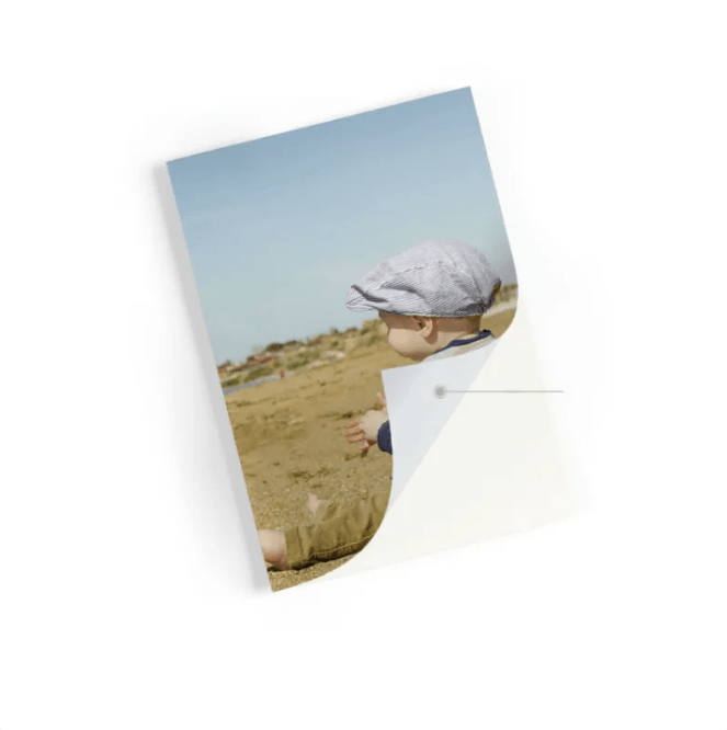 Color photo print of a child at the beach, showcasing the quality of a portable wireless photo printer.