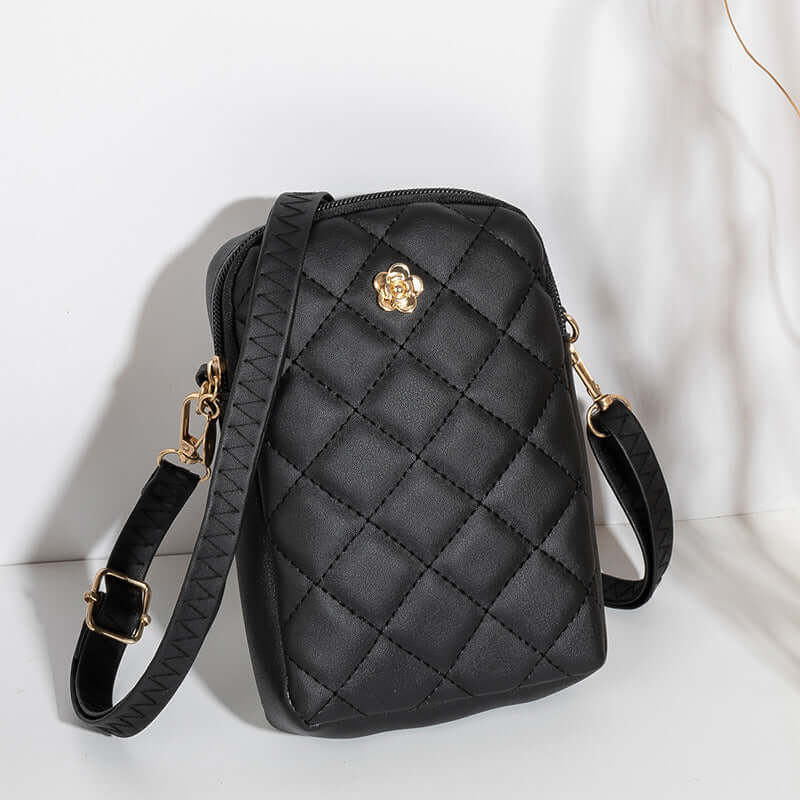 Embroidered Women's Crossbody Bag in black with quilted design and gold accents, perfect for travel and commuting.