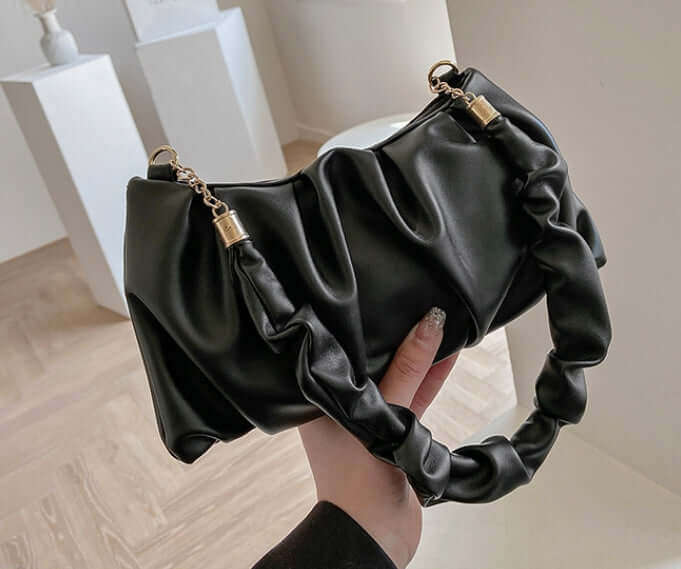 A stylish Cloud Bag, Shoulder Bag, Crossbody Bag in black, featuring a unique ruched design and elegant chain handles.