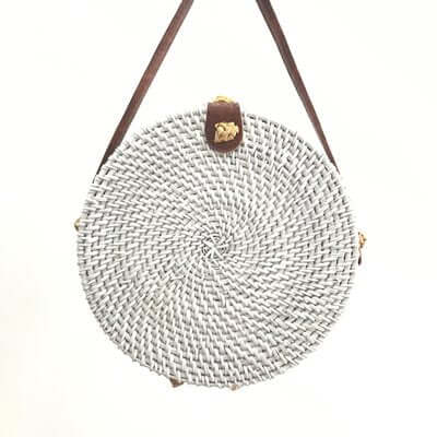 Colorful straw bucket bag with a chic round shape and stylish strap, perfect for casual outings.
