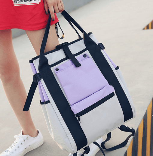 Trendy Canvas Backpack with purple and gray color contrast, ideal for stylish and functional design.