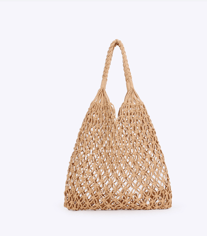 Stylish woven straw bags: Woven grass tote bag with braided handles in a chic design.