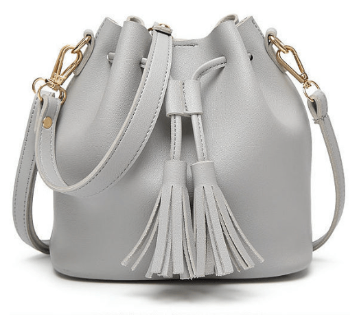 Bucket Bag, Crossbody Bag, Tote Bag in stylish gray leather with tassels and adjustable strap.