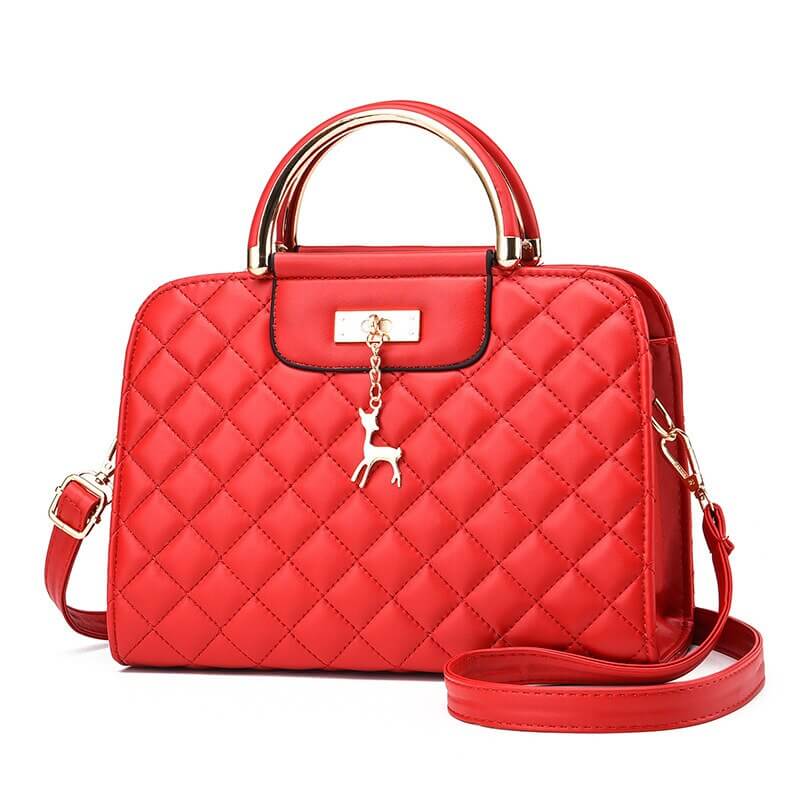 Fashionable red quilted leather shoulder bag with gold hardware and detachable strap.
