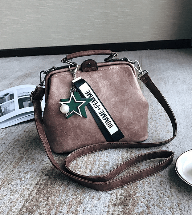Chic doctor shoulder bag in brown PU with a unique star charm and adjustable strap, perfect for style and functionality.