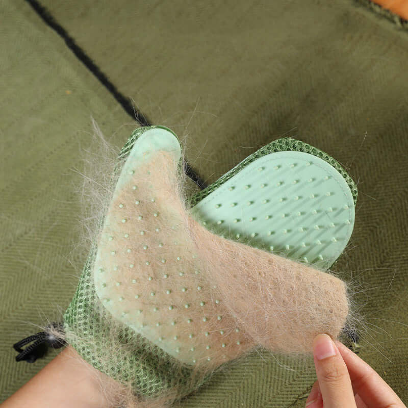 Silicone massage gloves for pet grooming removing hair from a pet's coat, showcasing effectiveness and ease of use.