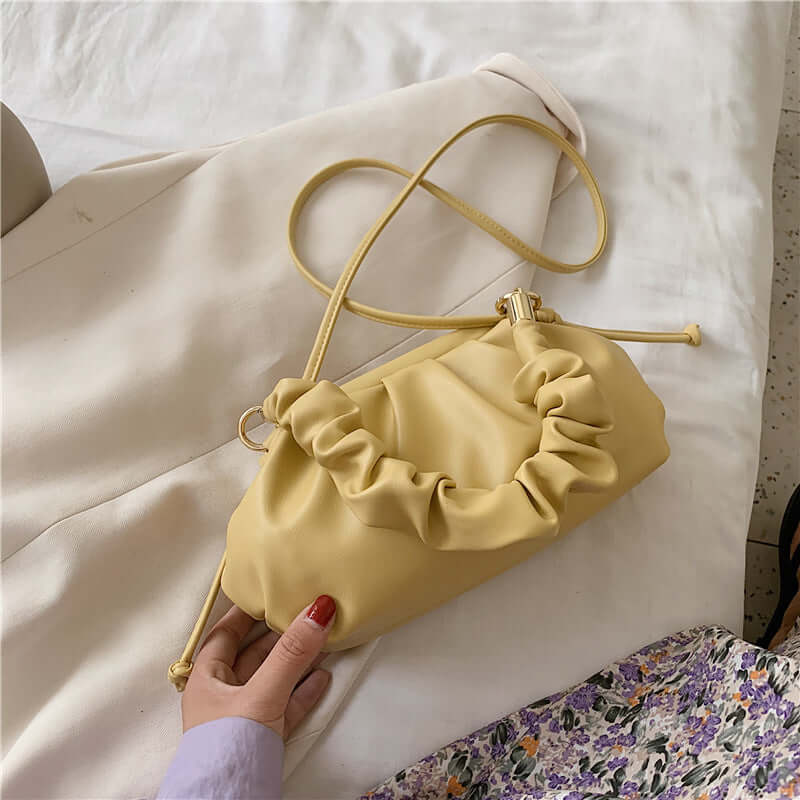 Cloud Bag, Shoulder Bag, Crossbody Bag in yellow with ruffled design on a white background