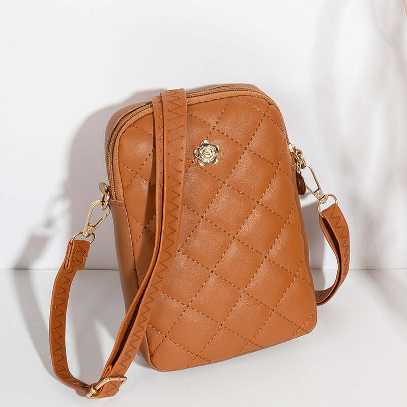 Embroidered Women's Crossbody Bag for Travel and Commuting in tan PU material with quilted design.