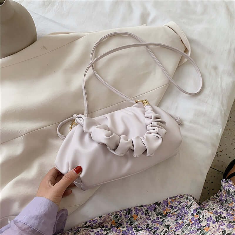 Cloud Bag, Shoulder Bag, Crossbody Bag in soft lilac, featuring ruffled design and adjustable strap.