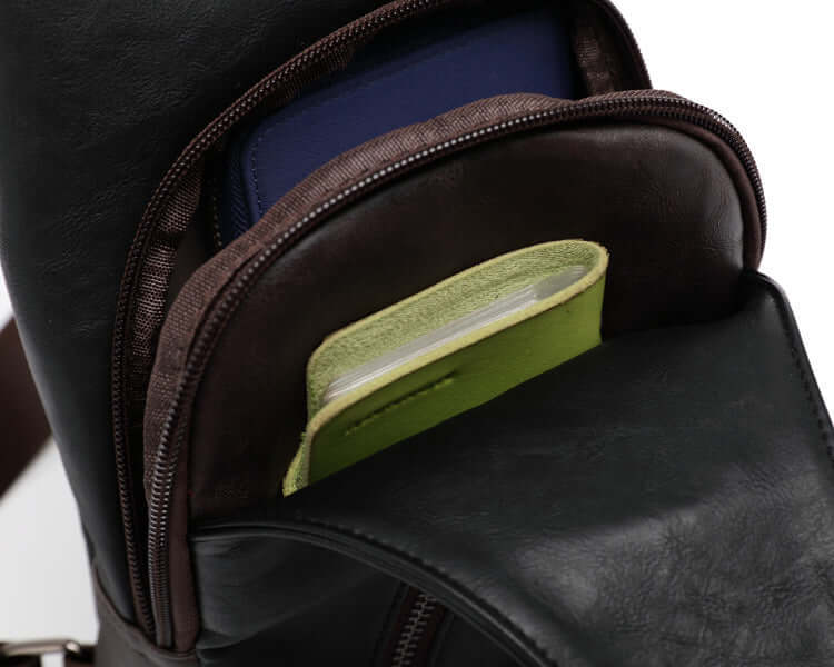 Men's waterproof chest bag interior showcasing multiple zipped compartments for organizing belongings.